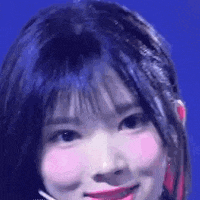 a close up of a woman 's face with a microphone in her hair .