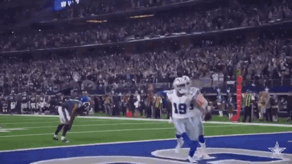 cowboys players number 19 and 9 are running on the field