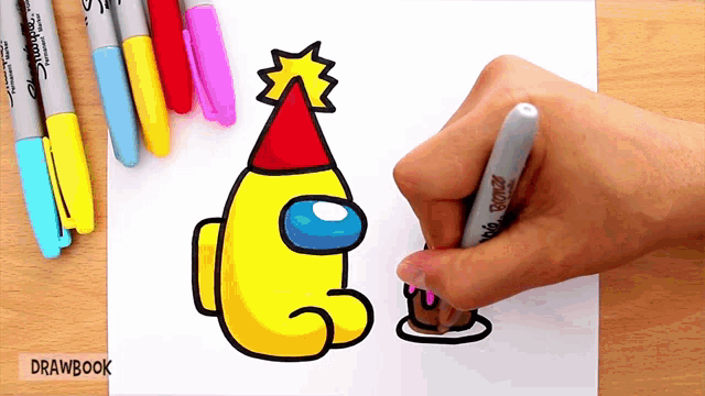 a person is drawing a yellow among us character with a party hat on