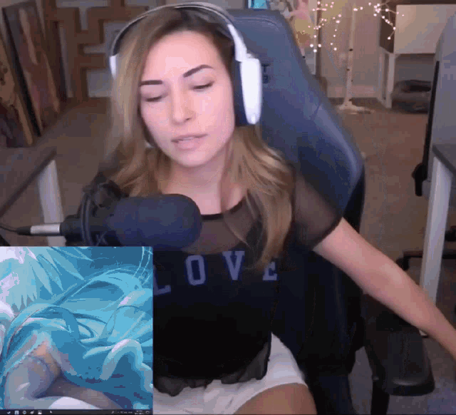 a woman wearing headphones and a shirt with the word love on it