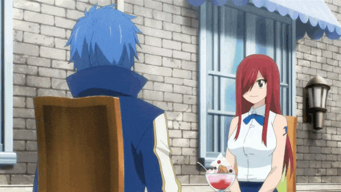a girl with red hair is holding a bowl of ice cream next to a man with blue hair
