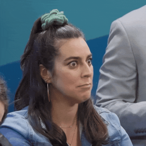 a woman with a green scrunchie on her head