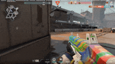 a person holding a colorful rifle in a video game with a score of 100