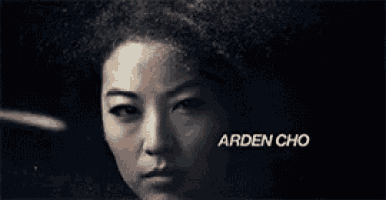 a close up of a woman 's face with the name arden cho on the bottom .
