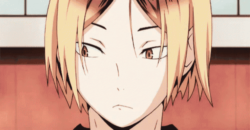 a close up of a person 's face with a yellow haired anime character .