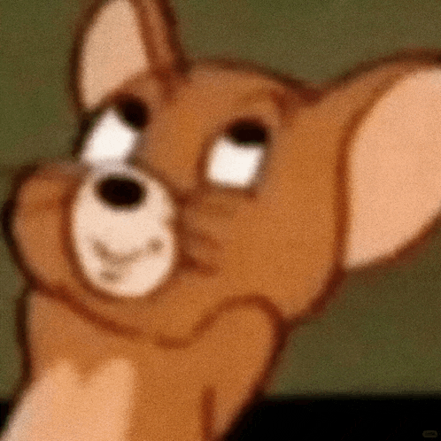 a close up of jerry from tom and jerry making a face .