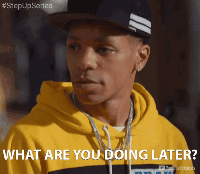 a man wearing a yellow hoodie and a black hat says what are you doing later