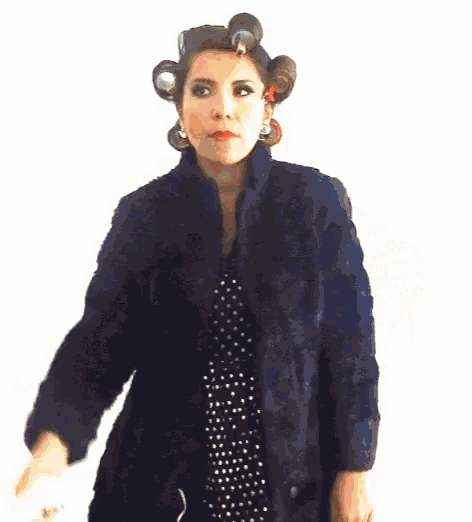a blurry picture of a person 's face with a red nose and a blue jacket