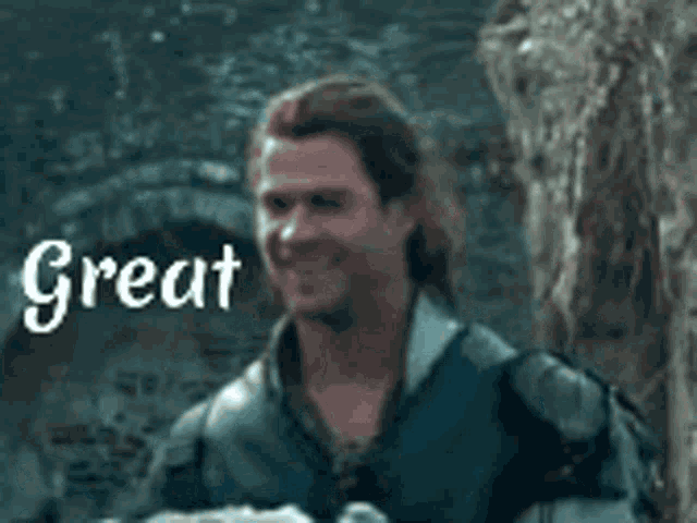 a man in a knight 's costume is smiling and holding a piece of bread .