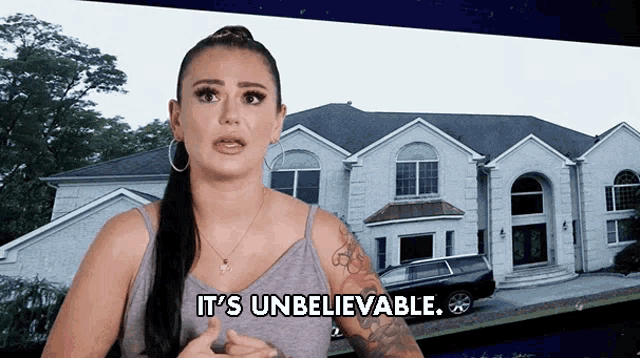 a woman says it 's unbelievable in front of a picture of a house