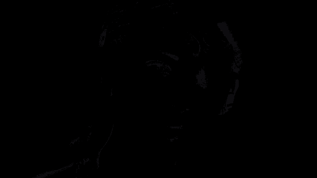 a close up of a woman 's face with her hand on her head
