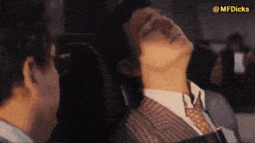 a man in a suit and tie is sleeping with his eyes closed and the words @mfdicks above him