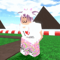a girl wearing a white shirt that says i love unicorns is standing in front of pyramids .