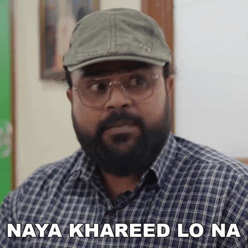 a man with a beard wearing a hat and glasses says naya khareed lo na