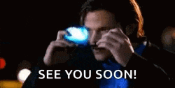 a man wearing sunglasses is standing in front of a police car with the words `` see you soon '' .