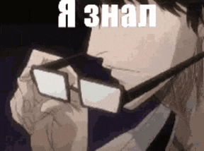 a man wearing glasses and a tie is holding his hand to his face .