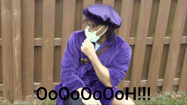 a man in a purple robe is sitting in front of a wooden fence with the words oooooooh !!! below him