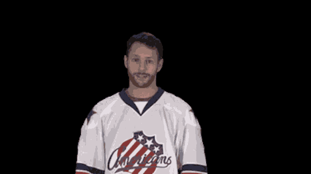 a man wearing an americans jersey giving a thumbs up
