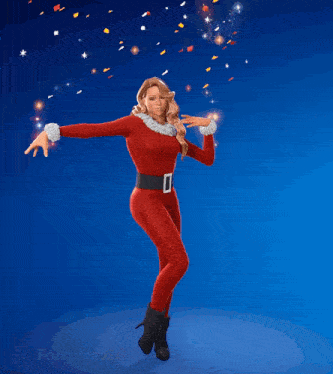 a woman in a santa outfit is dancing with her hands in the air