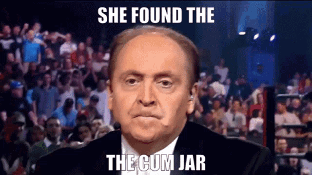 a man in front of a crowd with a caption that says she found the the cum jar