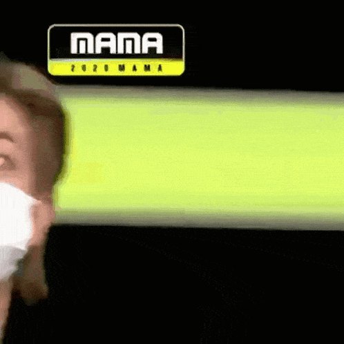 a person wearing a mask is standing in front of a sign that says mama