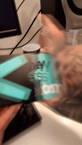 a blurred image of a person holding a box that says ' ey boost ' on it