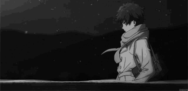 a black and white photo of a boy wearing a coat and scarf .