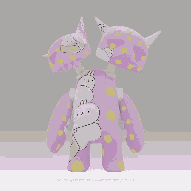 a purple stuffed animal with the word gn on it