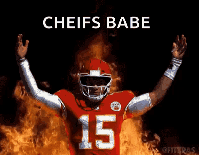 a football player with the number 15 on his jersey is in front of flames