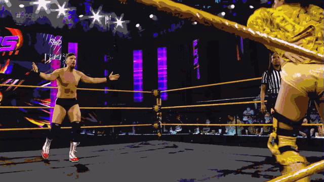 a man in a wrestling ring with a sign that says 205 live on it