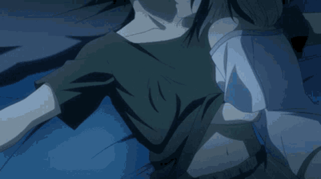a man and a woman are laying on a blue blanket