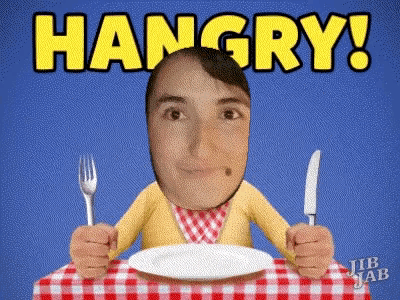 a man sitting at a table with a plate and a knife and fork with the words hangry above him
