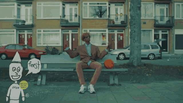 a man is sitting on a park bench with a basketball and a speech bubble that says feest