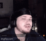 a man wearing headphones and a headband looks at the camera