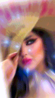 a blurred image of a woman holding a fan