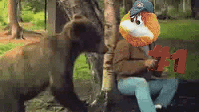 a man is sitting next to a bear wearing a hat that says ' oakland ' on it