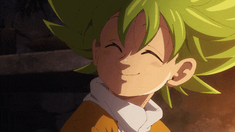 a cartoon character with green hair is smiling and wearing an orange shirt