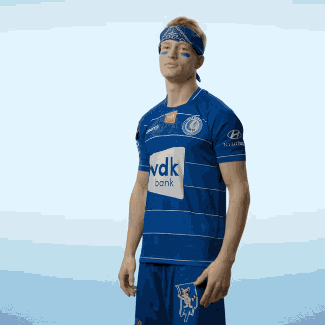 a man wearing a blue shirt with the word bank on it