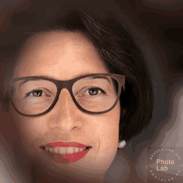 a close up of a woman wearing glasses with a photo lab logo