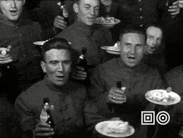 a group of soldiers drinking beer and eating food