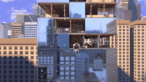 a man is sitting on the side of a building with a city in the background