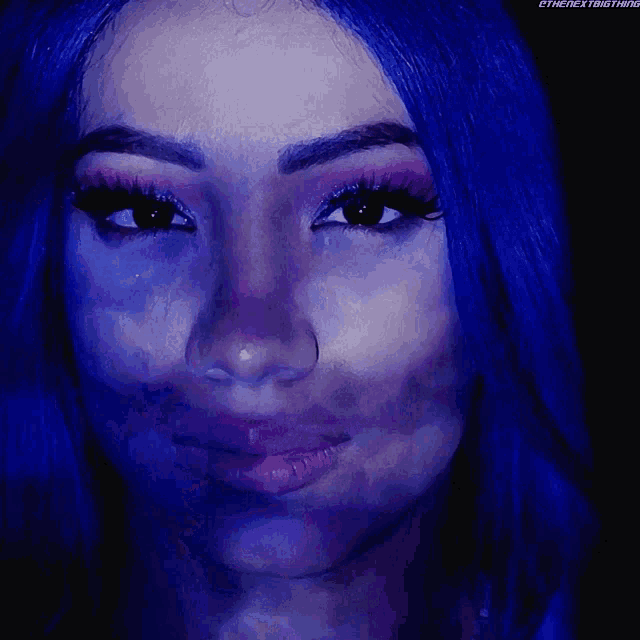 a close up of a woman 's face with the words " the next thing " on the bottom right