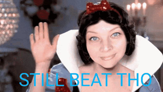 a woman in a snow white costume with the words still beat tho