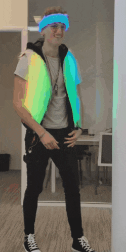 a man wearing a glow in the dark vest and a blue headband