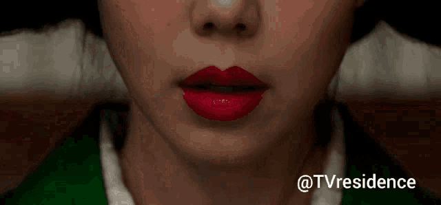 a close up of a woman 's face with red lipstick and the words @tvresidence