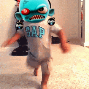 a kid wearing a gap shirt with a clown mask on his face