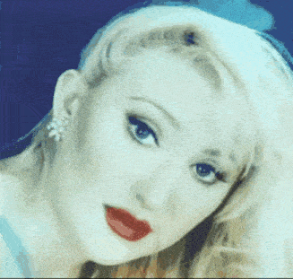 a close up of a woman 's face with red lips