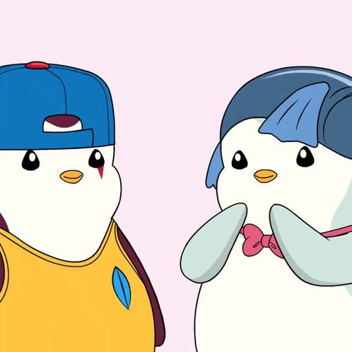 two penguins are standing next to each other one wearing a blue hat