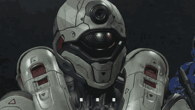 a close up of a robot 's face with a red eye