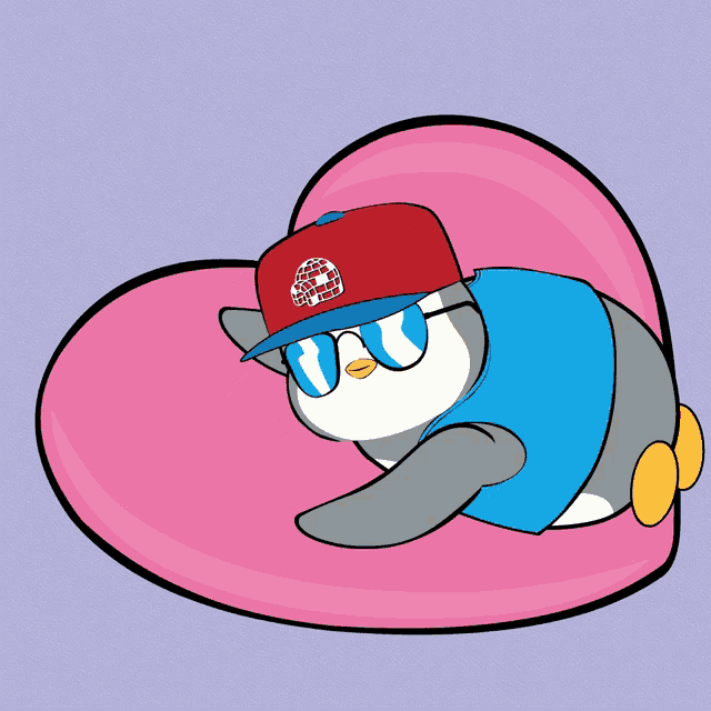 a penguin wearing a red hat and sunglasses is laying on a heart